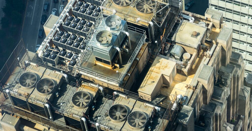 High-angle shot of HVAC units on a city building's rooftop, showcasing industrial infrastructure.